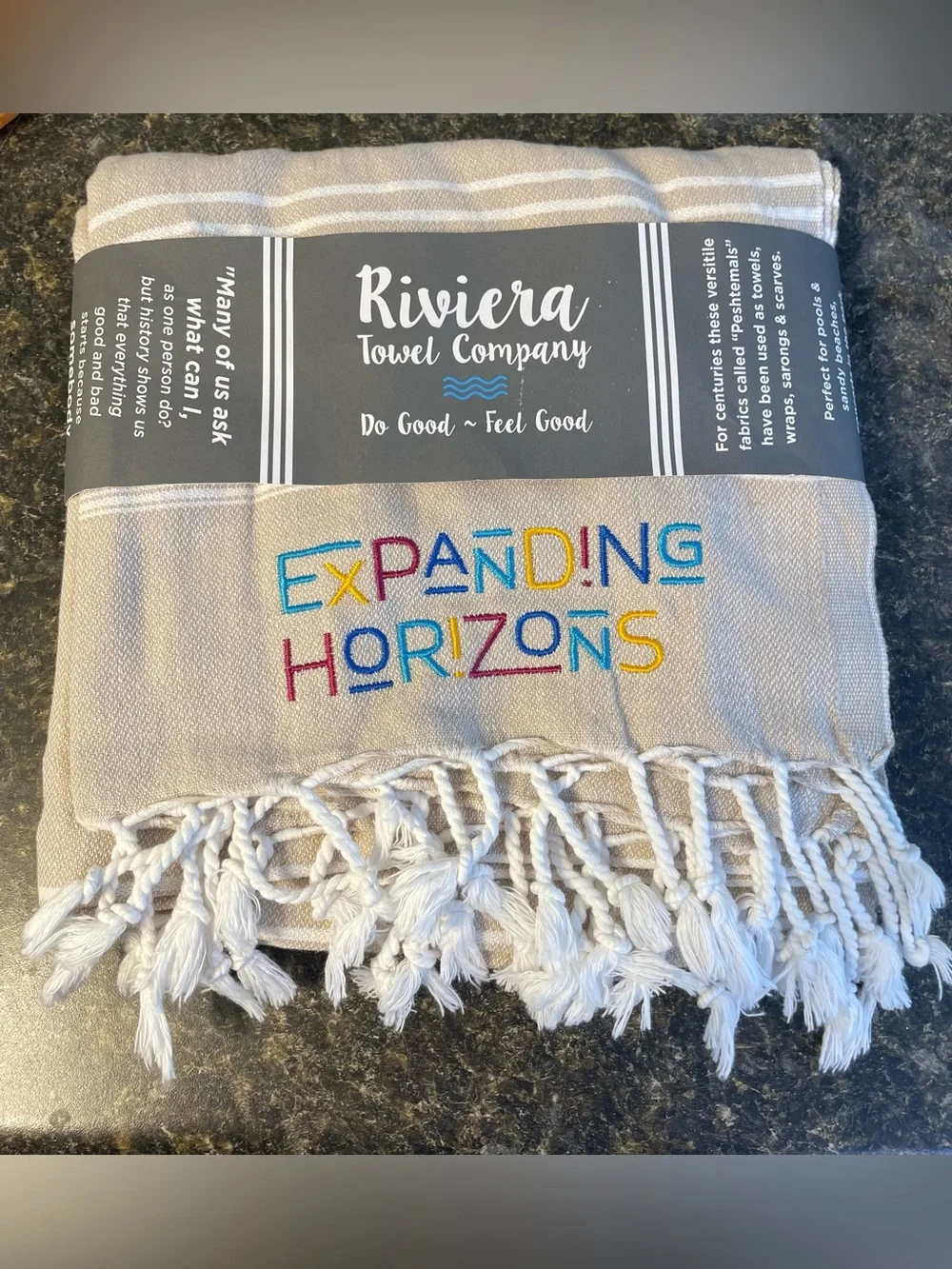 Riviera Towel Company Turkish Pestemal towel in a beige color white stripes.